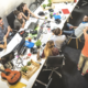 team working together hand in hand in a room